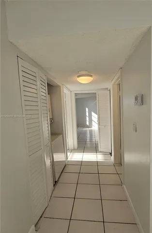 a view of a livingroom with an oven and window