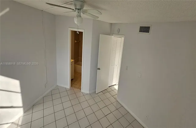 a view of empty room with windows