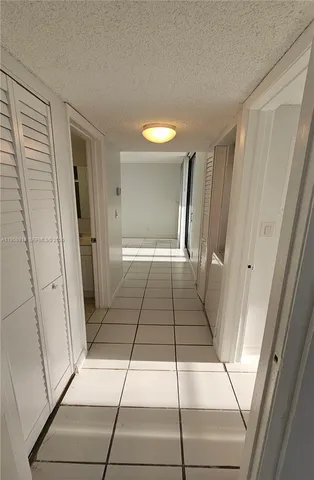 a view of a house with a yard and garage