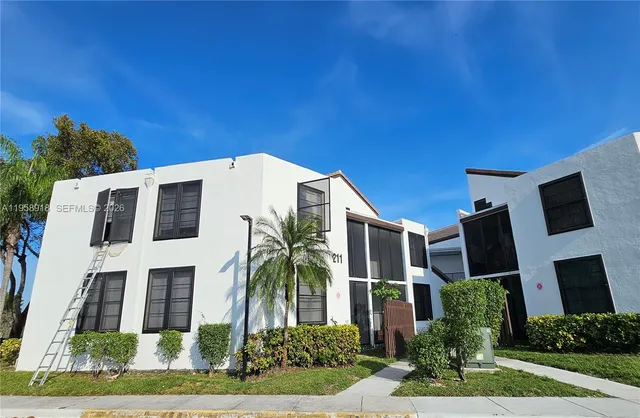 a view of sign board and yard