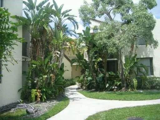 a view of a house and a yard