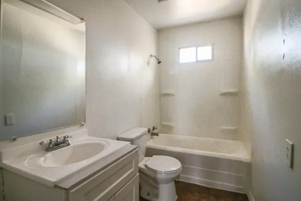 a bathroom with a sink toilet and bathtub