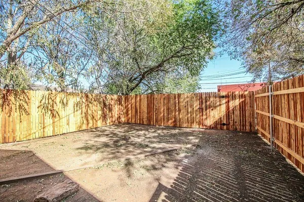 a view of outdoor space with wooden fence