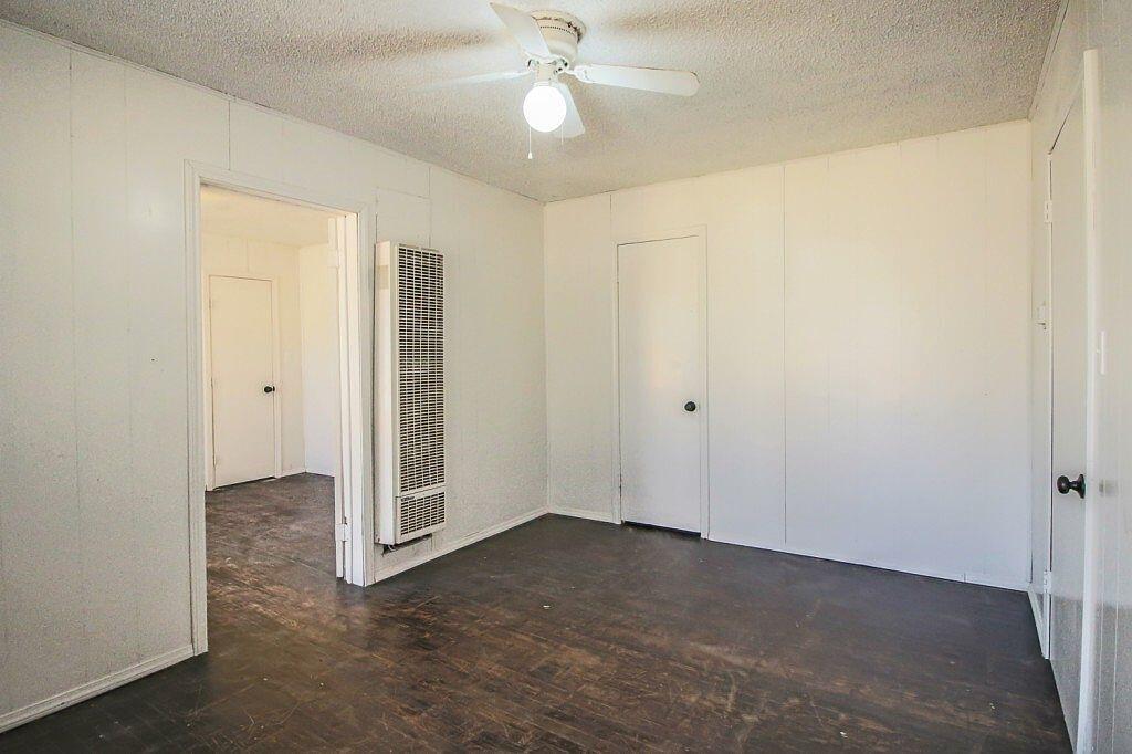 1805 Avenue R Lubbock, TX 79401 - Photo 4 of 18 an empty room with closet and a chandelier fan
