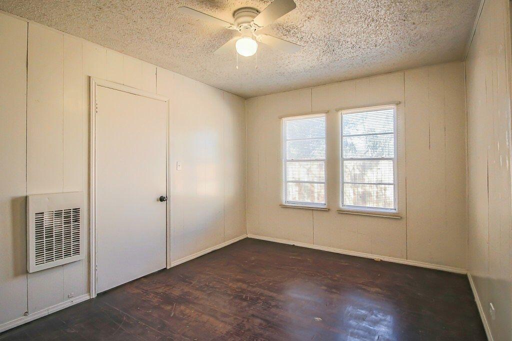 1805 Avenue R Lubbock, TX 79401 - Photo 5 of 18 an empty room with windows and fan