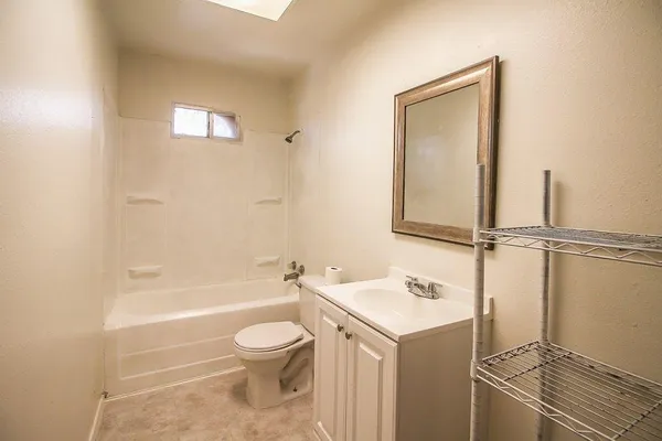a bathroom with a toilet sink and a bathtub