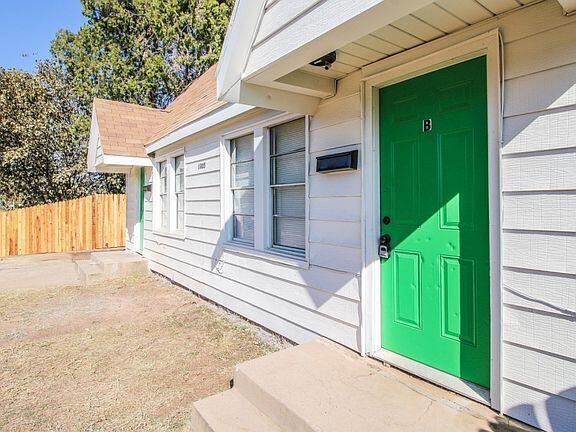 1805 Avenue R Lubbock, TX 79401 - Photo 10 of 18 a view of a house with a backyard and a garage