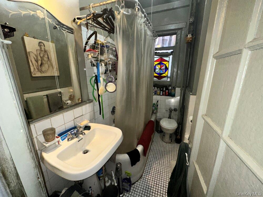 203 West 81st Street, Unit 4E Manhattan, NY 10024 - Photo 12 of 17 a view of walk in closet with clothes and shoes