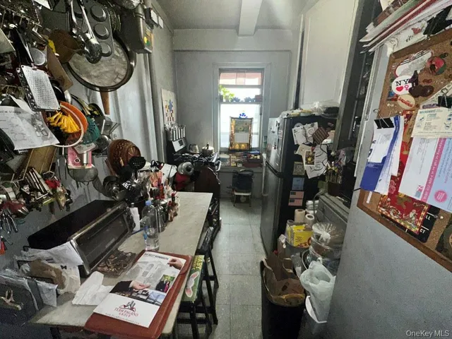 a view of a dining room with furniture and window