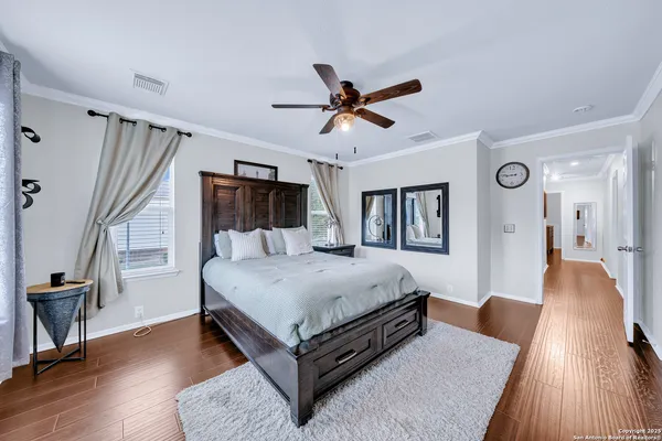 a bed room with a bed and a chandelier