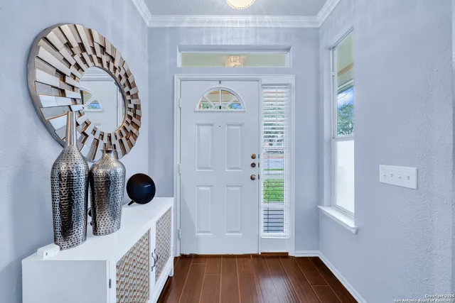 a view of entryway with wooden floor