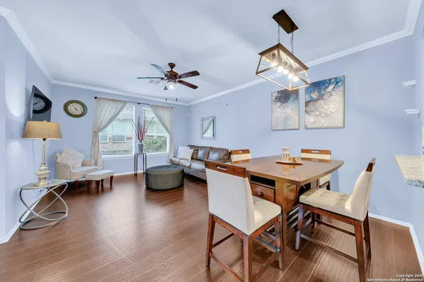a view of a dining room with furniture window and wooden floor