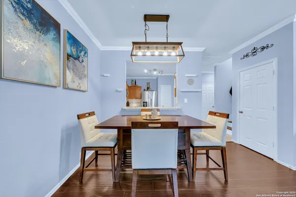a view of a dining room with furniture and wooden floor