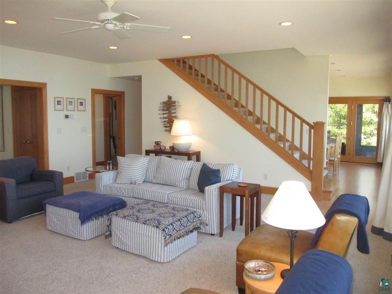37433 Apostle Bay Road Bayfield, WI 54814 - Photo 8 of 49 Flows to dining, kitchen, den/office, entry foyer, main floor bedroom/bath, upstairs & lakeside deck