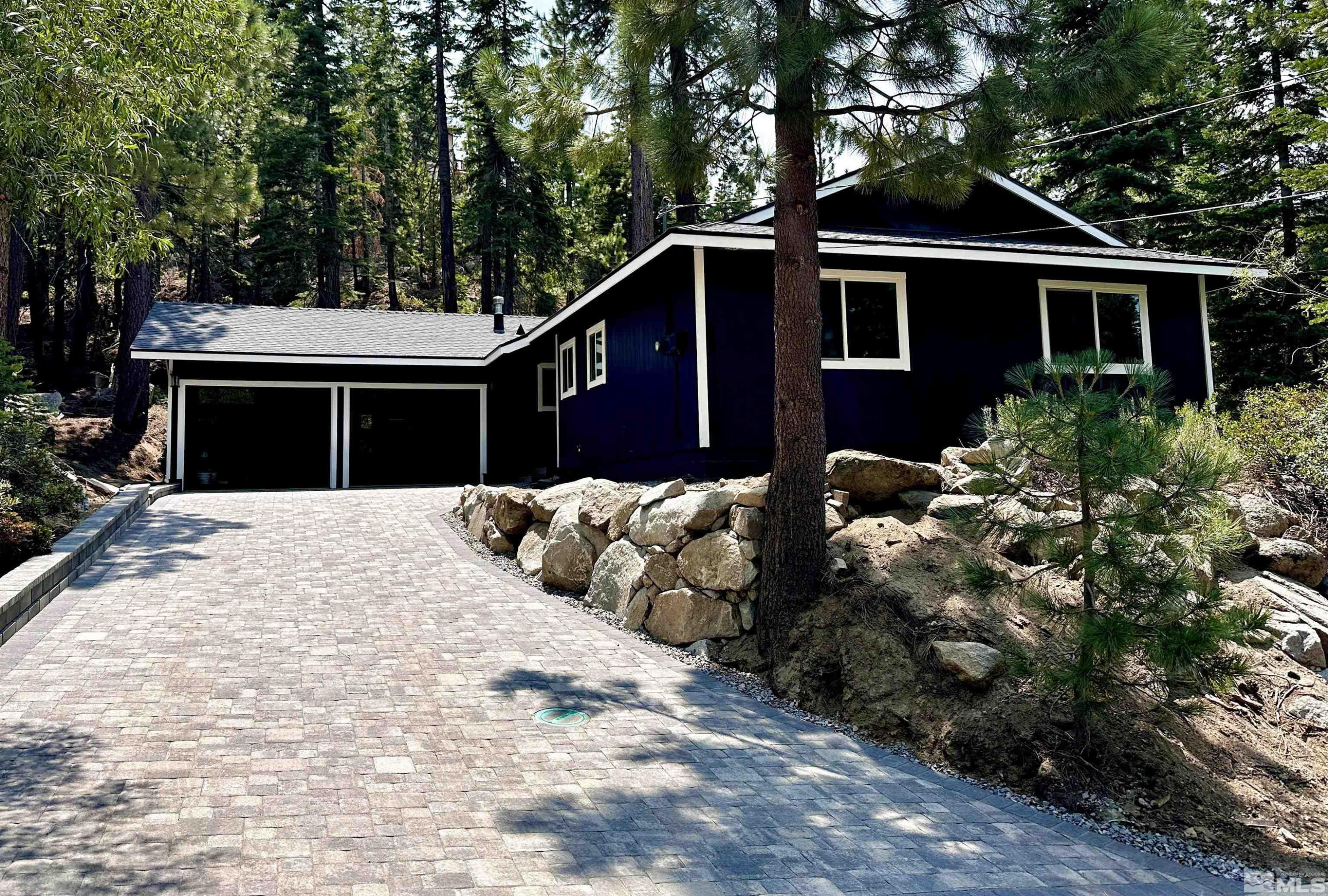 421 Edgewood Drive Stateline, NV 89449 - Photo 14 of 29 a front view of a house with a yard