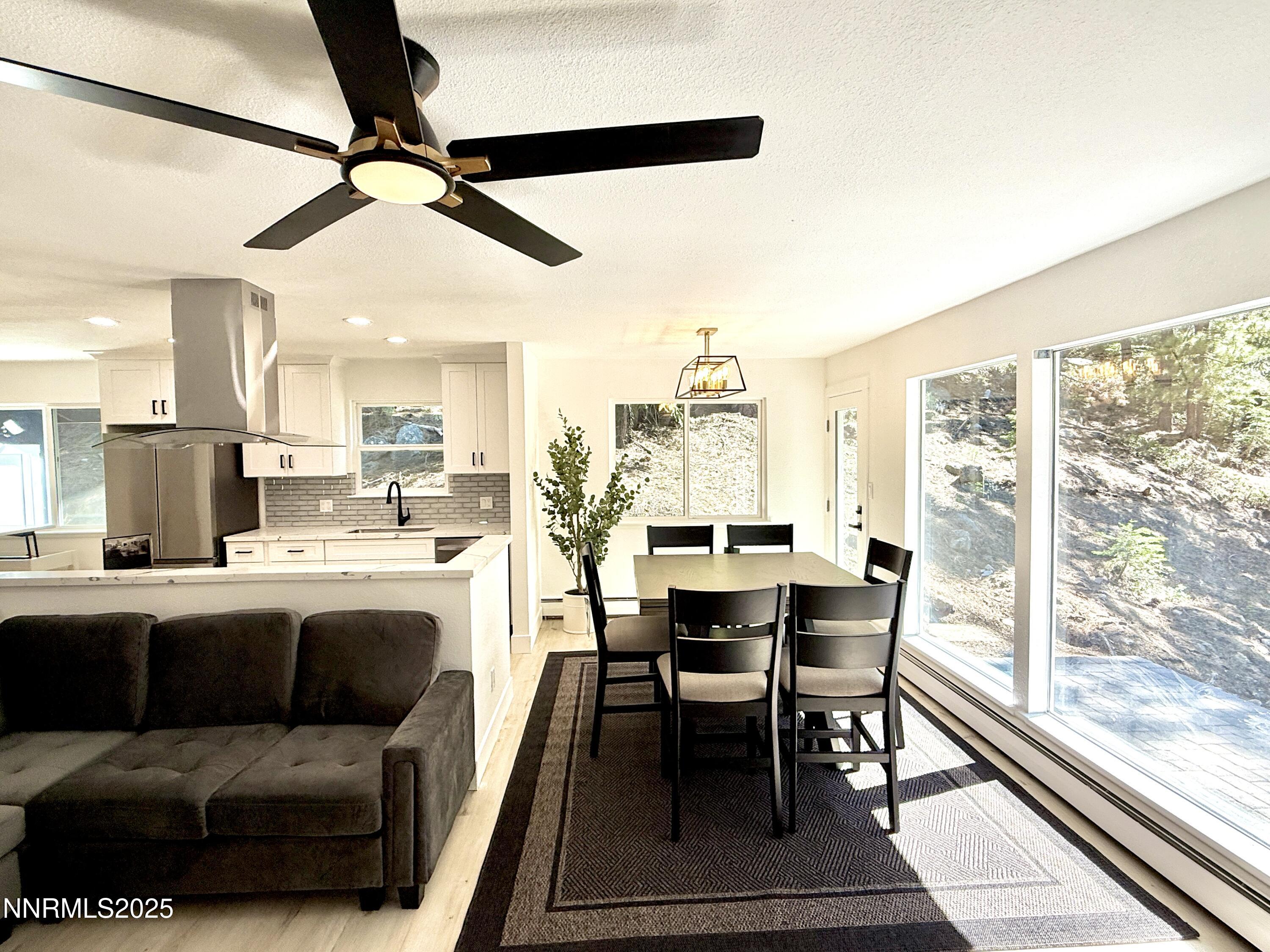 421 Edgewood Drive Stateline, NV 89449 - Photo 7 of 29 a view of a dining room with furniture window and wooden floor