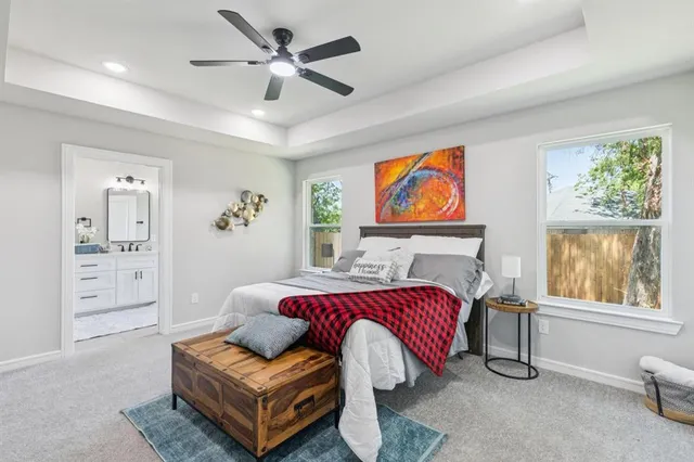 a spacious bedroom with a bed and a couch