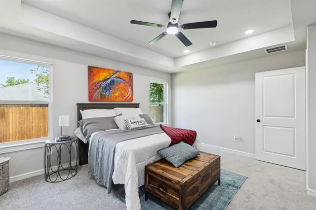 a bedroom with furniture and a window