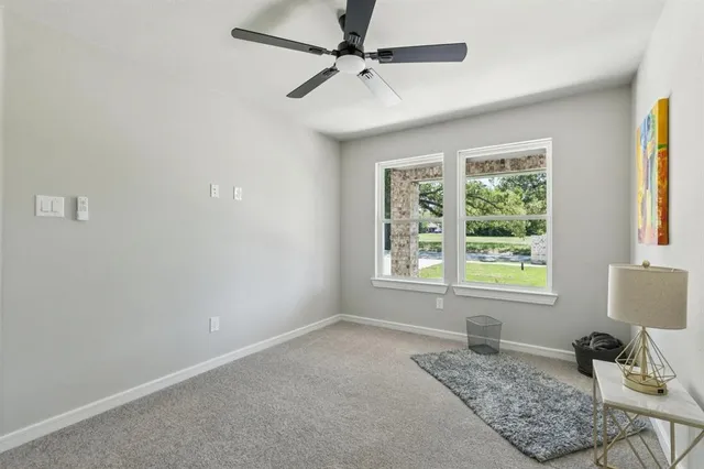 a room that has a bed and a window in it