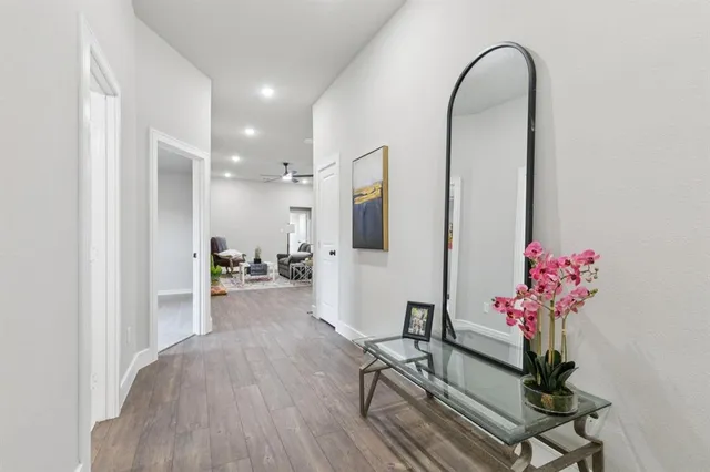 a living room with furniture and flowers