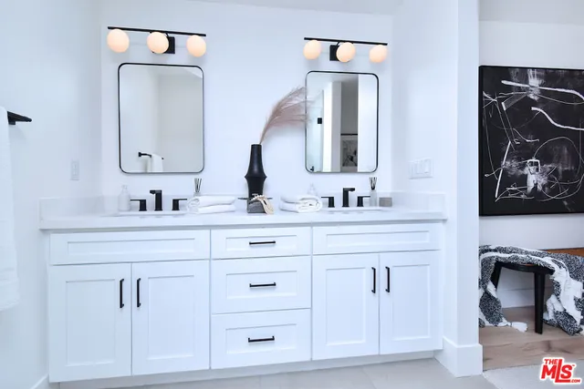 a bedroom with a bed a desk and chair