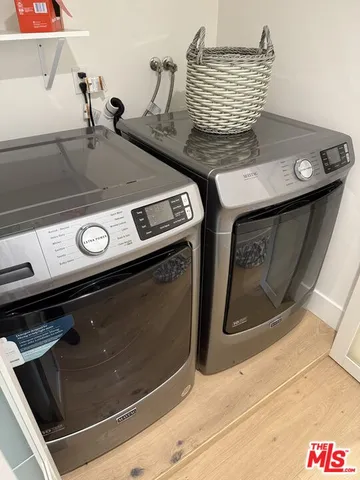a view of a patio with couches table and chairs with potted plants