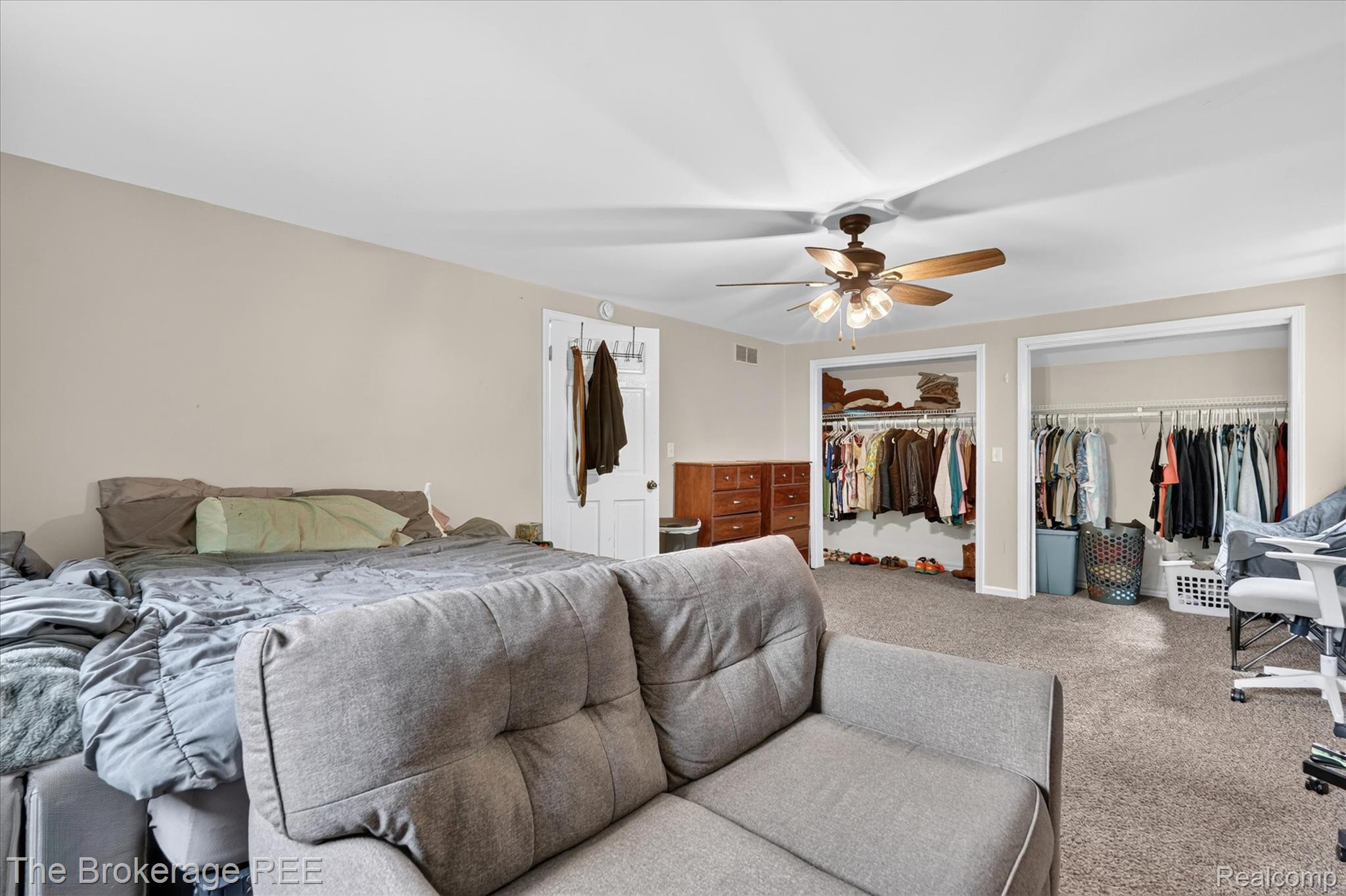 13269 North Genesee Road Clio, MI 48420 - Photo 28 of 67 Spacious room featuring neutral wall paint, light-colored carpeting, and a ceiling fan with integrated lighting