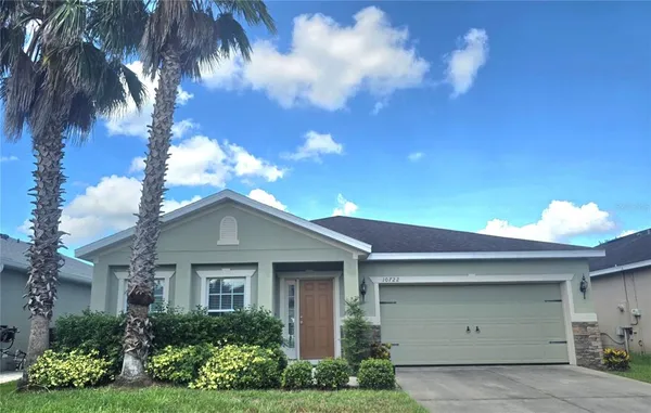 a kitchen with stainless steel appliances granite countertop a refrigerator a stove and a sink