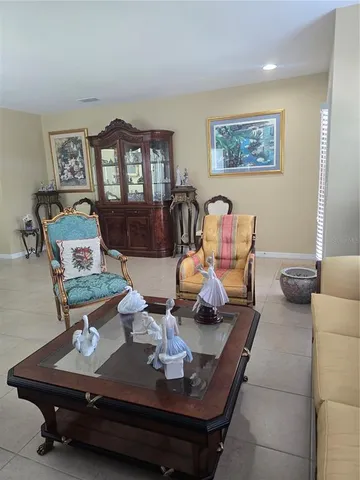 a kitchen with stainless steel appliances granite countertop a refrigerator a stove and a sink with wooden cabinets