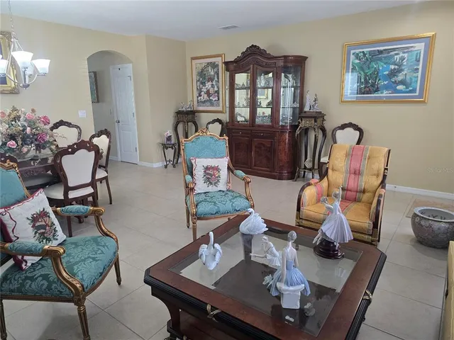 a kitchen with stainless steel appliances granite countertop a refrigerator a stove and a sink