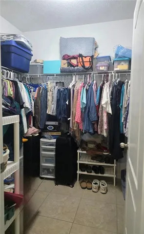 a bathroom with a toilet and shower