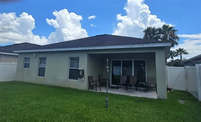 a backyard of a house with lots of green space