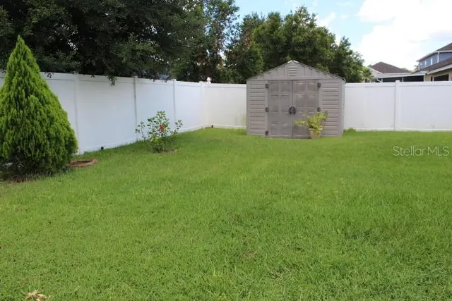 a view of a lake with a yard