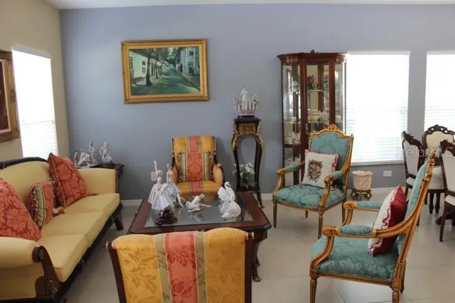 a living room with furniture and a mirror
