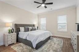 a bedroom with a bed and a dresser