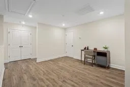 a view of work space with wooden floor and furniture