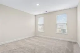 a view of a workspace with furniture and wooden floor