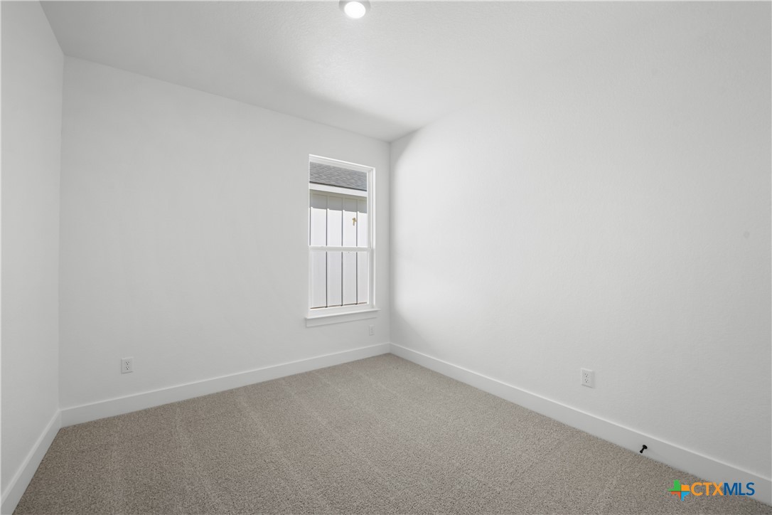 1803 Bear Grass Rdg Road Temple, TX 76501 - Photo 13 of 16 an empty room with a window