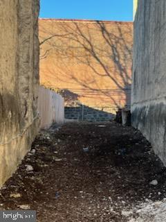 6015 Lansdowne Avenue Philadelphia, PA 19151 - Photo 3 of 9 a view of a yard with wooden fence
