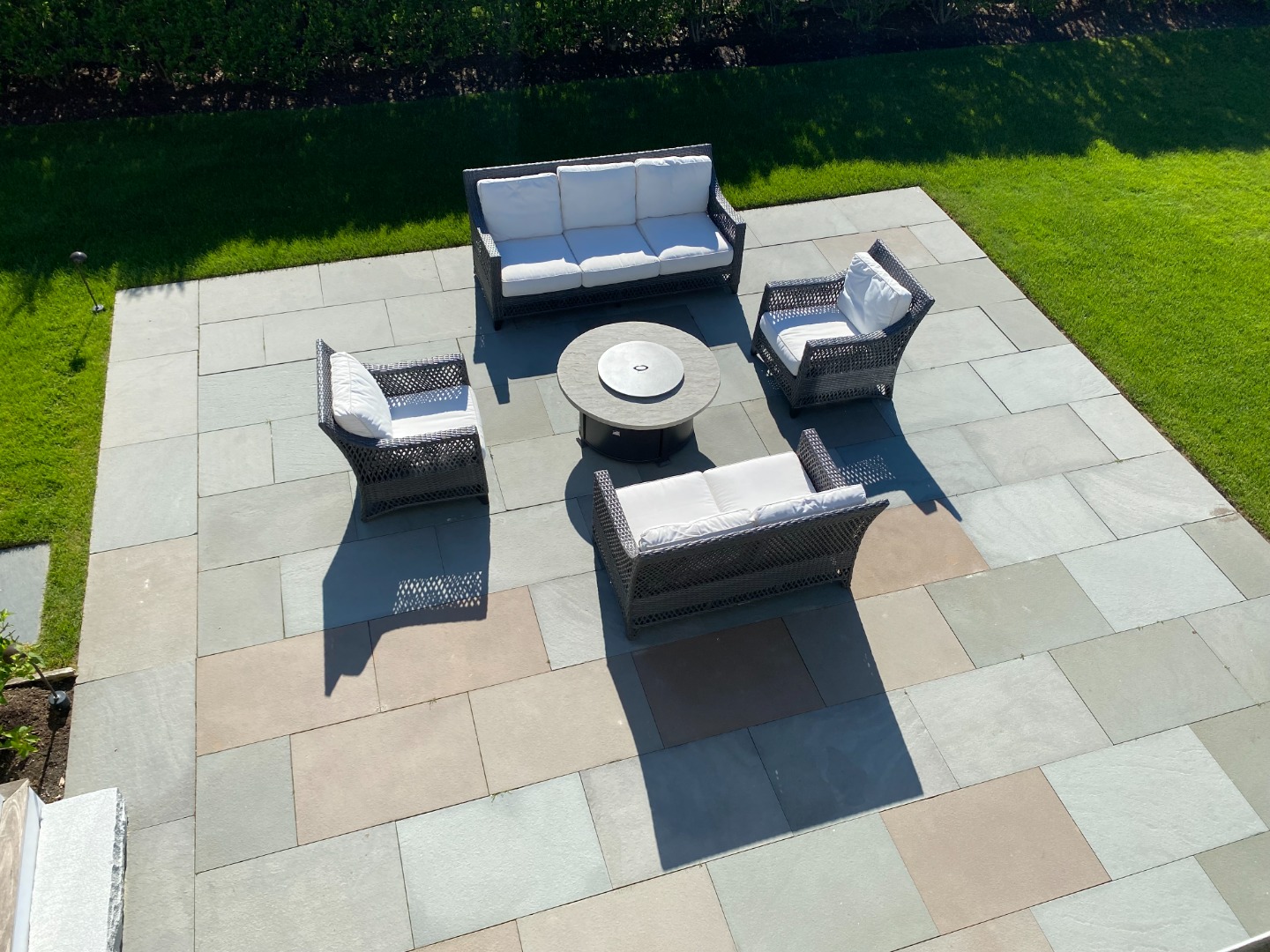 76 Baxter Road Nantucket, MA 02554 - Photo 24 of 25 a view of a patio with couches table and chairs with garden view