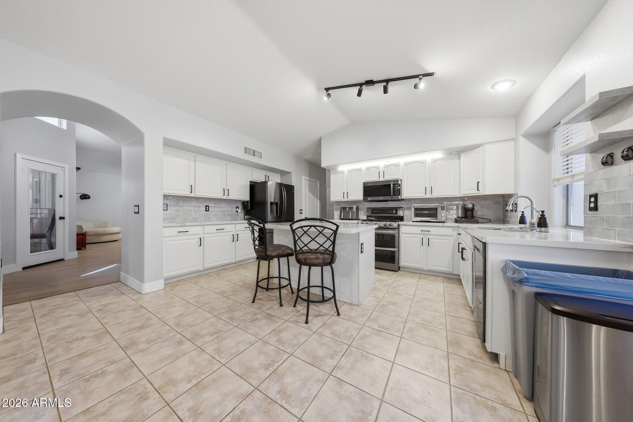 2153 East Kempton Road Chandler, AZ 85225 - Photo 9 of 50 a kitchen with cabinets and chairs