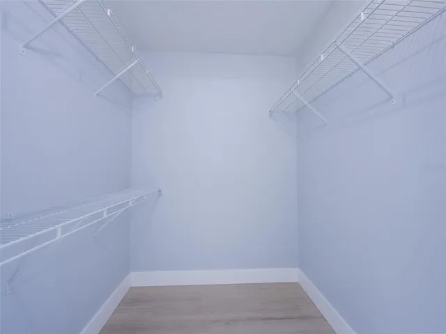 a bathroom with a granite countertop sink mirror and double