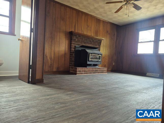 2807 Moyer Road Powhatan, VA 23139 - Photo 11 of 15 an empty room with windows and fireplace
