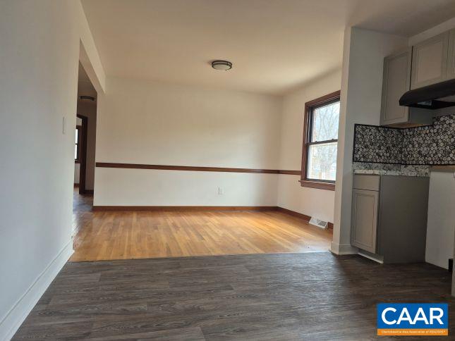 2807 Moyer Road Powhatan, VA 23139 - Photo 4 of 15 a view of a room with wooden floor and a fireplace