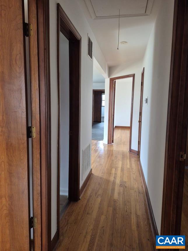 2807 Moyer Road Powhatan, VA 23139 - Photo 8 of 15 a view of a hallway with wooden floor