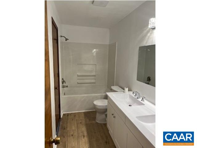 2807 Moyer Road Powhatan, VA 23139 - Photo 9 of 15 a bathroom with a double vanity sink toilet and shower