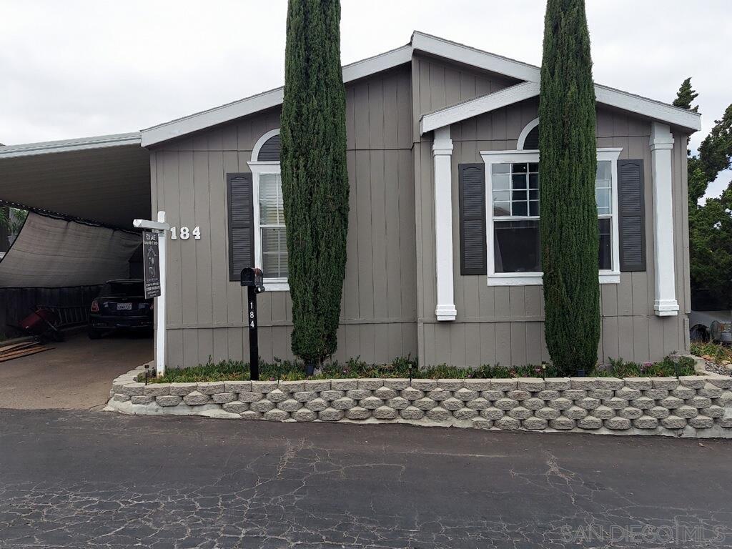 13162 Highway 8 Business, Unit SPC 184 El Cajon, CA 92021 - Photo 1 of 18 a front view of a house