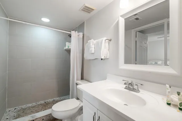 a view of a big yard with lots of green space