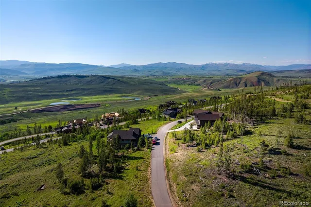 a view of a city with mountains in the background