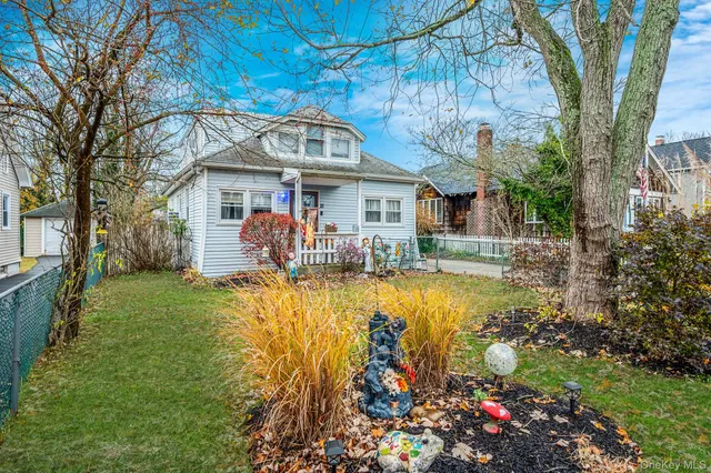 a view of a house with swimming pool yard and outdoor seating